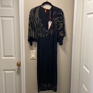 Anama gross light sexy. Has open back with a overlay